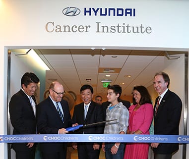 From left, Mickey Pong, Chairman of the Board, Hyundai Hope on Wheels; Dr. Leonard Sender, Medical Director, Hyundai Cancer Institute; B.H. Lee, Chief Executive Coorinator Hyundai Motor America; CJ George, Hyundai Hope on Wheels Ambassador; Kim Cripe, President and CEO CHOC Children's and Jerry Flannery, Executive VP and General Counsel Hyundai Motor America cut the ribbon during "Every Handprint Has A Story" Hyundai Hope on Wheels handprint ceremony at CHOC Children's Hospital on Tuesday, July 23, 2013, in Orange, Calif. (Photo by Ryan Miller/Capture Imaging)